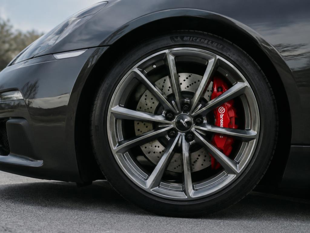 Close-up photograph of an alloy wheel and brake caliper